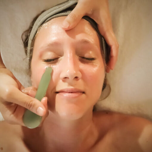 Clinician performing advanced Gua Sha technique in a Spa